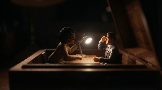 Dark dramatic diorama of a stressful interview with a lamp aimed directly at the candidate figurine
